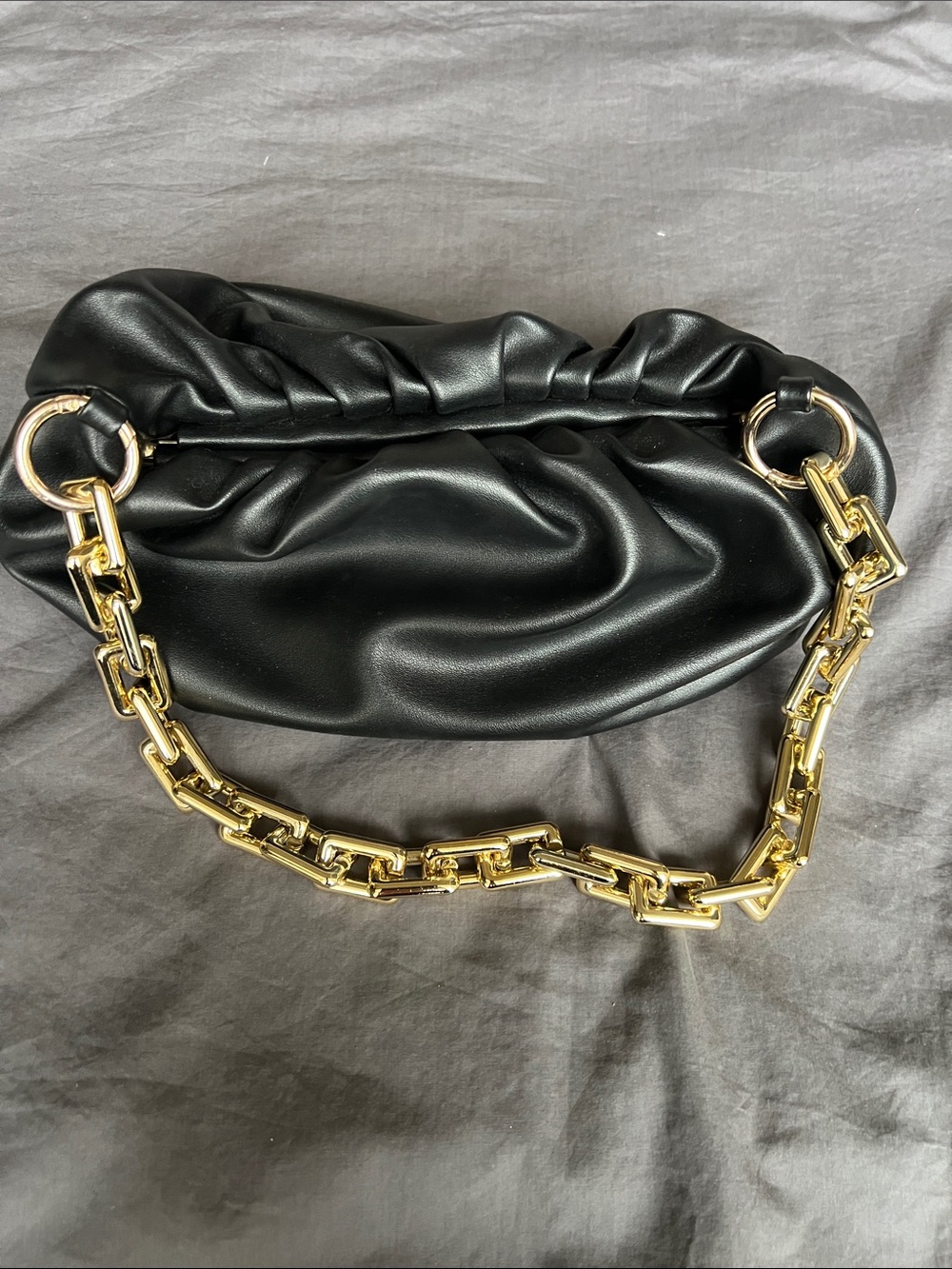 Elegant Black Clutch with Statement Gold Chain